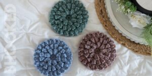 blue, purple and teal popcorn stitch flowers