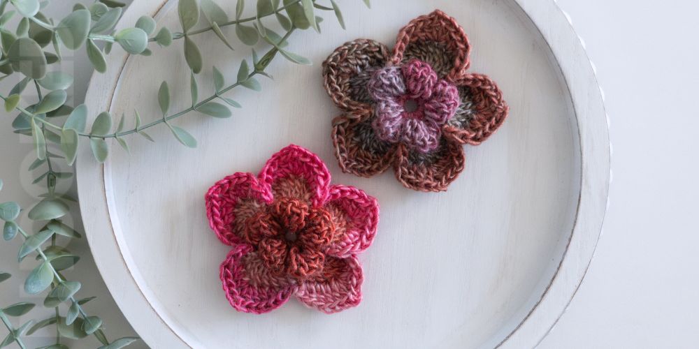 Two pink 3D crochet flower