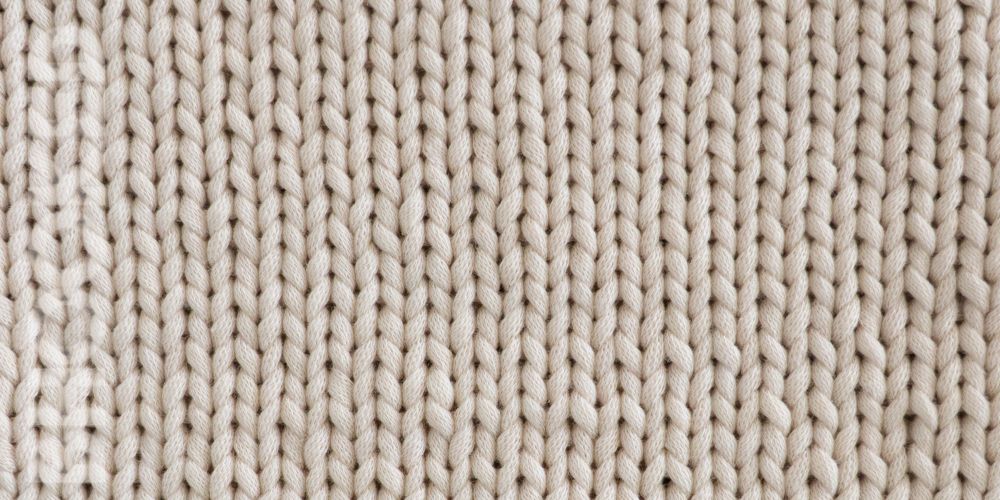Cream colored yarn knit stockinette stitch