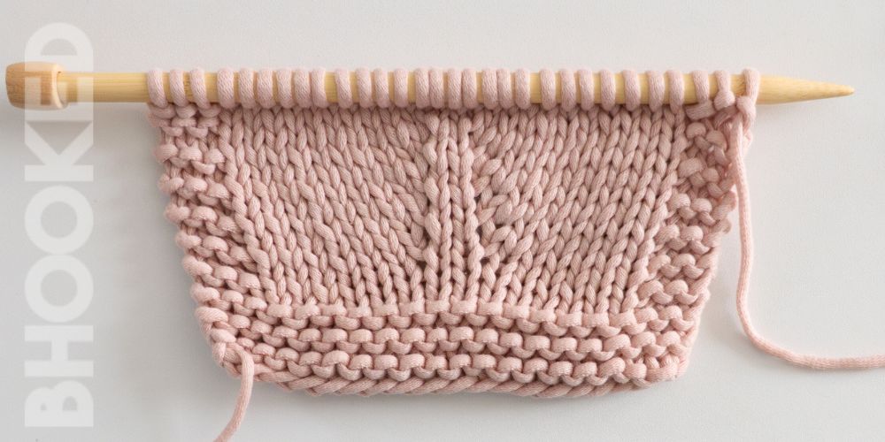 Pastel pink swatch with M1R and M1L knitting increases.