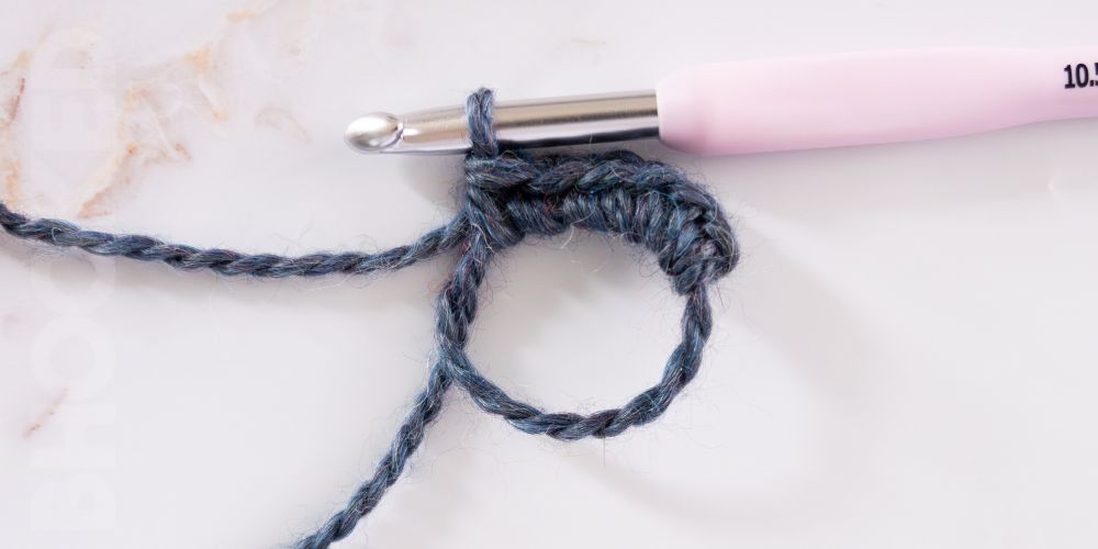 Easy Magic Circle with blue yarn.